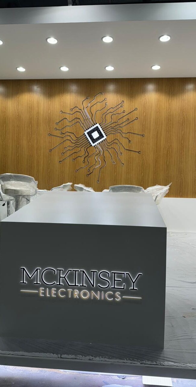 Exhibition stand with illuminated 3D branding and product displays